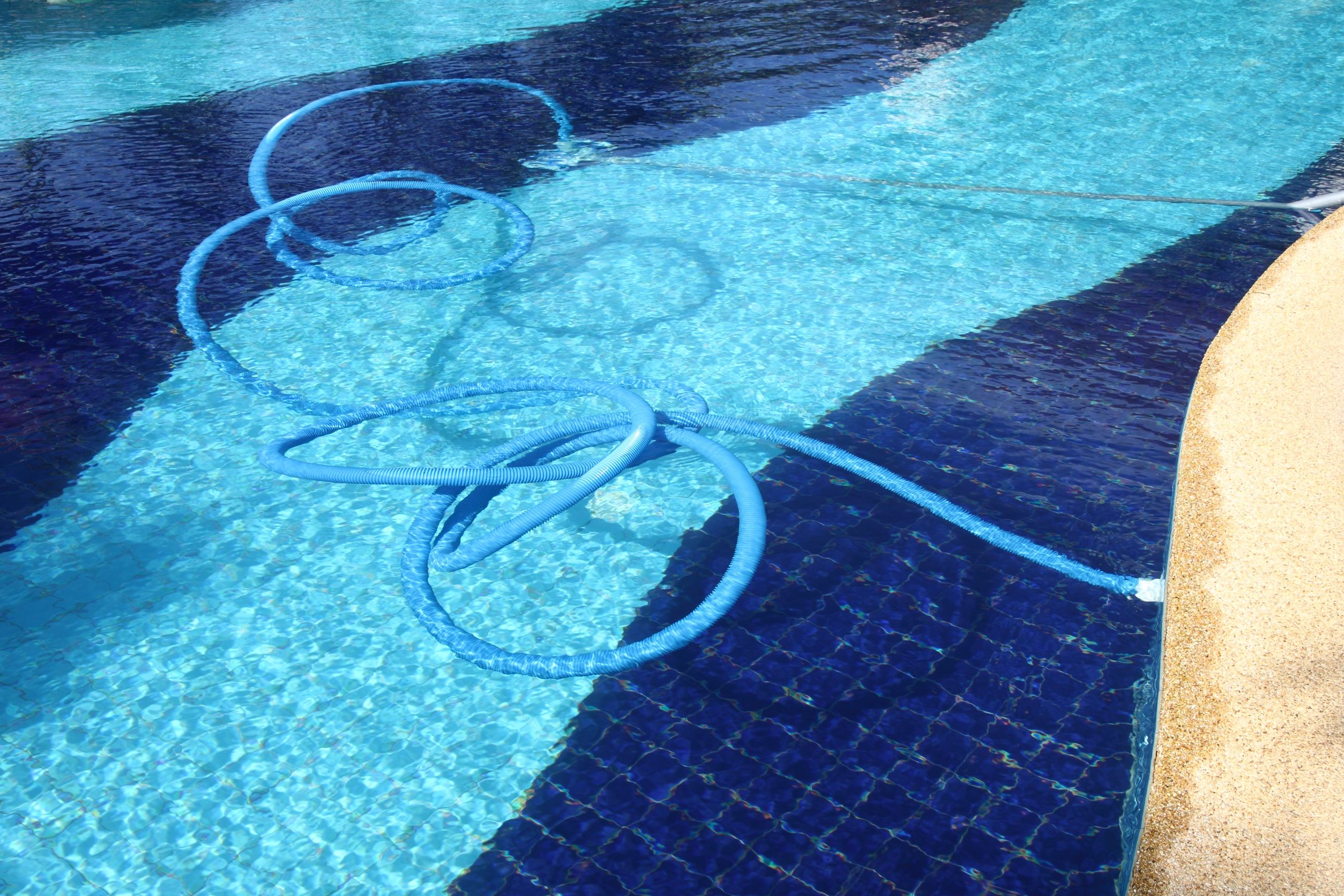 cleaning a swimming pool